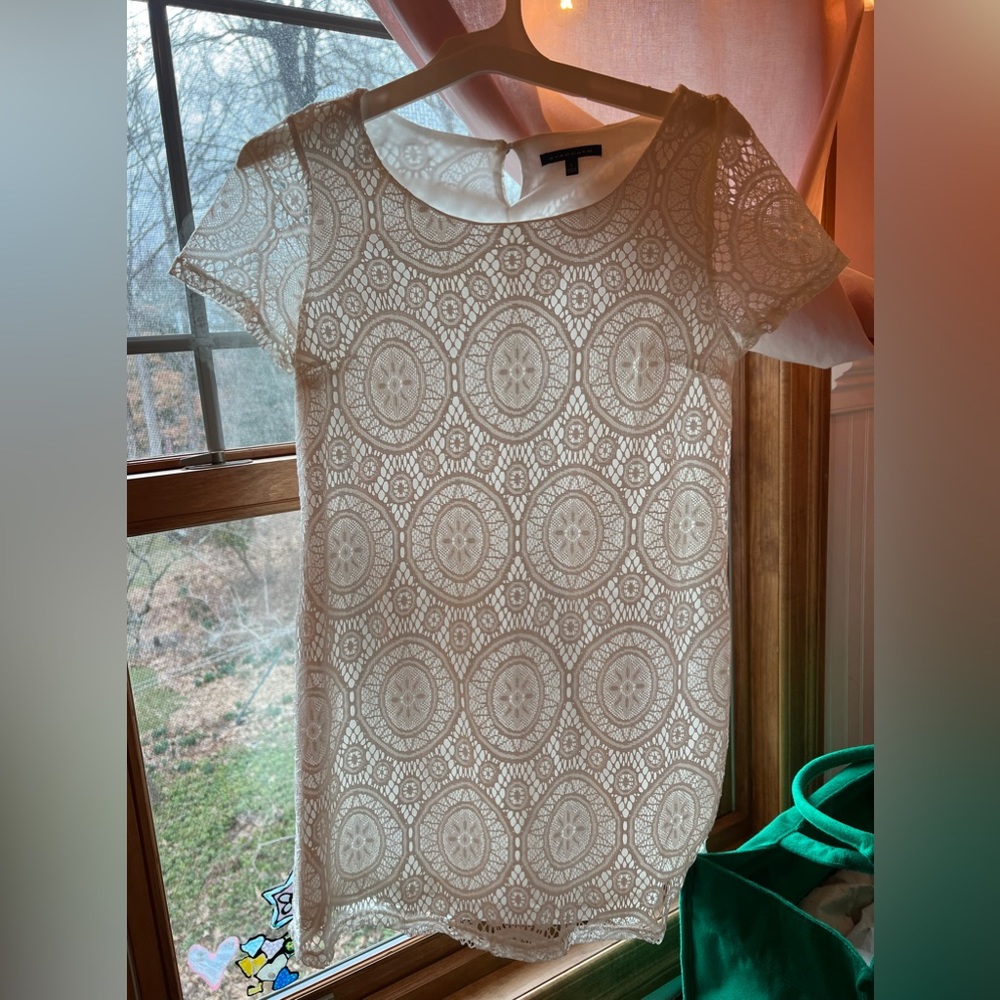 White lace mini dress from a boutique in the Caribbean